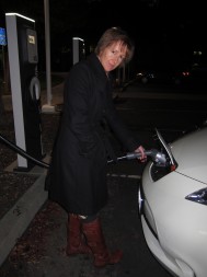 Alison van Diggelen charges at a Blink fast charger in Silicon Valley